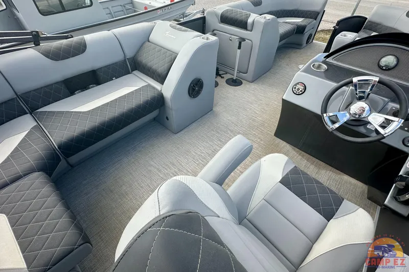Slide: The Image of 2024 Massimo P-21R boat interior with plush seating and modern steering console. - 20