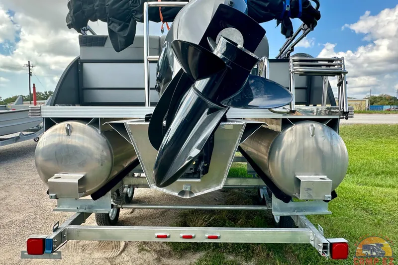 Slide: The Image of 2024 Massimo P-21R pontoon boat with dual pontoons and outboard motor on trailer. - 4
