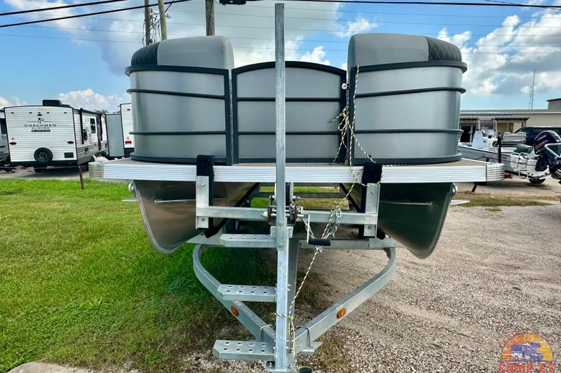 Slide: The Image of 2024 Massimo P-21R pontoon boat on trailer, parked outdoors. - 7