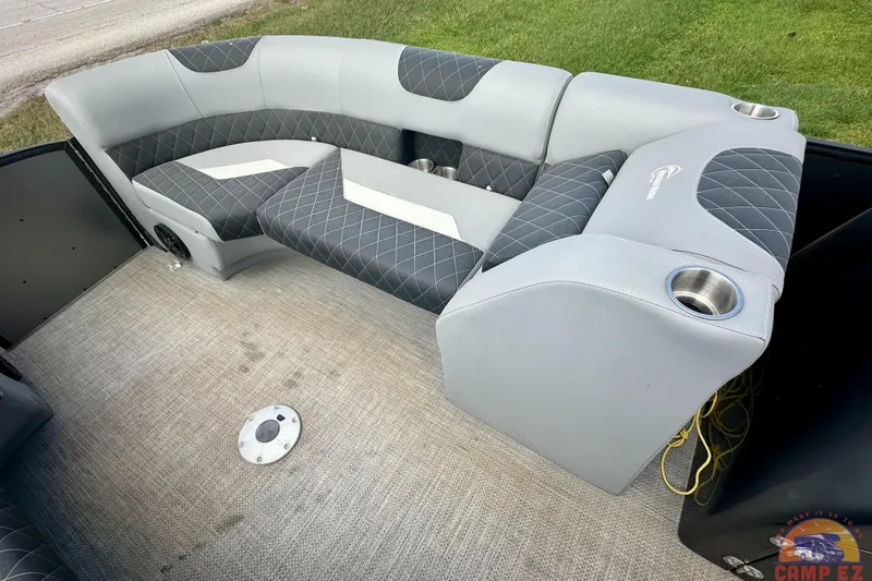 Slide: The Image of 2024 Massimo P-21R boat interior with gray seating and cup holders. - 8