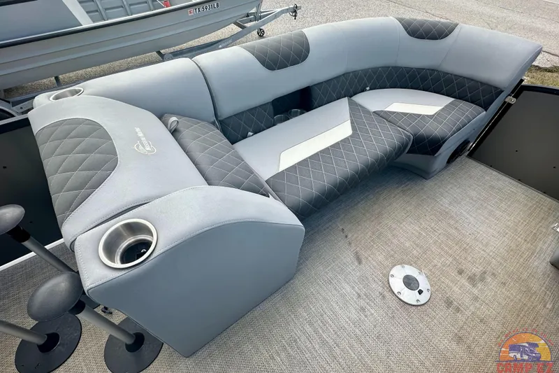 Slide: The Image of Luxurious seating on 2024 Massimo P-21R boat with quilted upholstery and cup holder. - 9