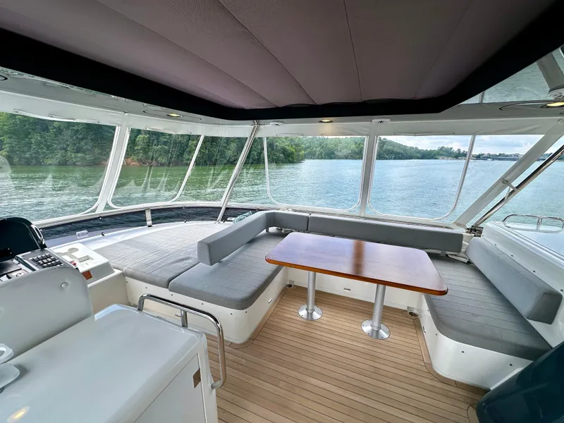 Slide: The Image of Interior of 2021 Sirena 58 yacht with panoramic windows and seating area. - 21