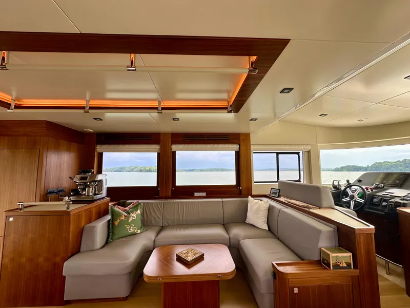 Slide: The Image of Luxurious interior of 2021 Sirena 58 yacht with modern furnishings and panoramic windows. - 39