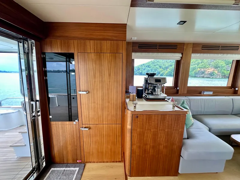 Slide: The Image of Interior of 2021 Sirena 58 yacht with wooden cabinetry and ocean view. - 41