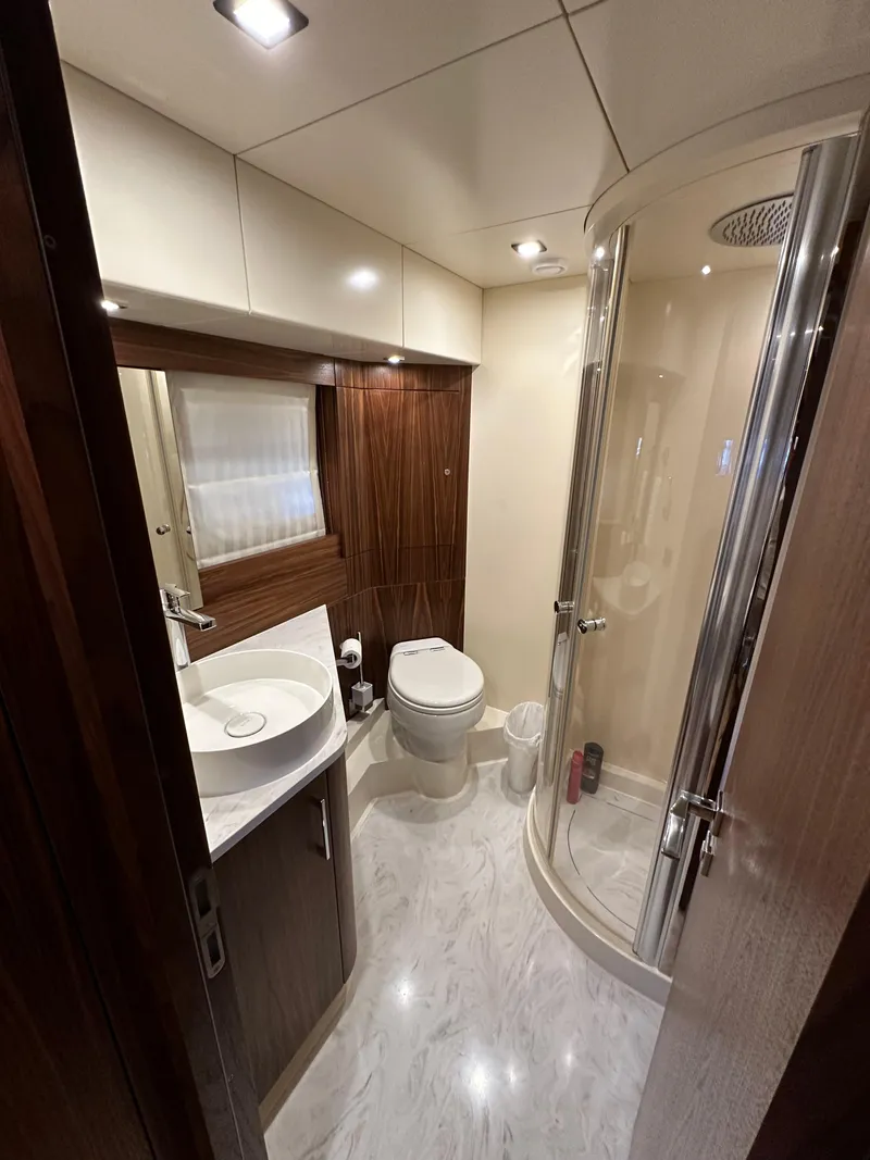 Slide: The Image of Modern bathroom in 2021 Sirena 58 yacht with shower, sink, and toilet. - 43
