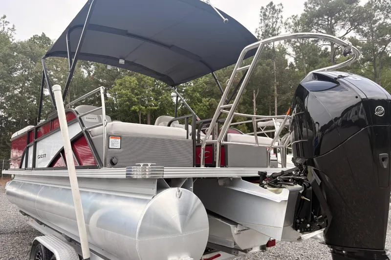 Slide: The Image of 2023 Crest Classic LX 220 SLRC pontoon boat with canopy and powerful outboard motor. - 12