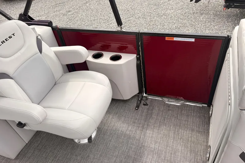 Slide: The Image of 2023 Crest Classic LX 220 SLRC boat interior with plush seating and cup holders. - 18