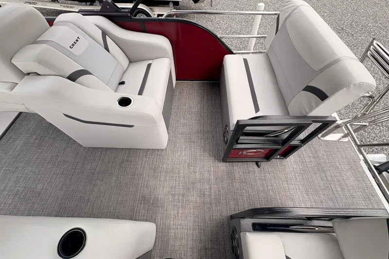 Slide: The Image of 2023 Crest Classic LX 220 SLRC boat interior with gray seating and cup holders. - 7