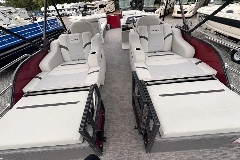 Slide: The Image of 2023 Crest Classic LX 220 SLRC pontoon boat with luxurious seating and modern design. - 9