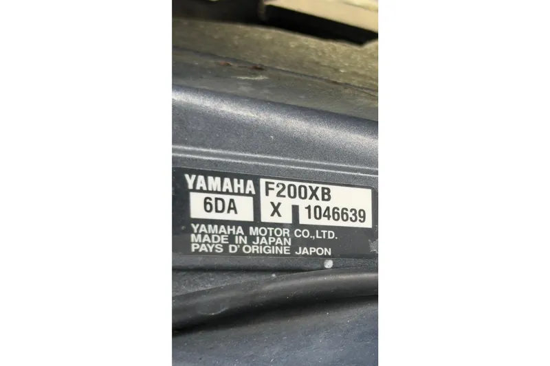 Slide: The Image of Yamaha F200XB engine label on 2020 Cobia 220 Center Console, made in Japan. - 12