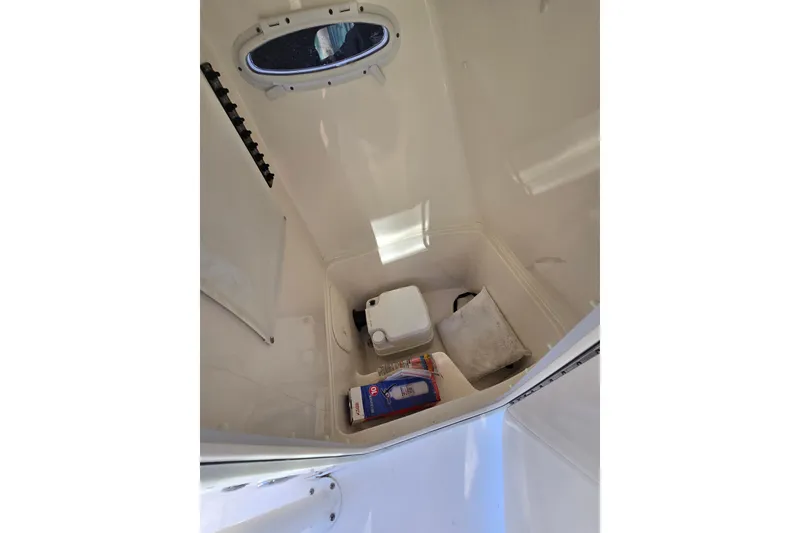 Slide: The Image of Interior storage compartment of 2020 Cobia 220 Center Console boat. - 20