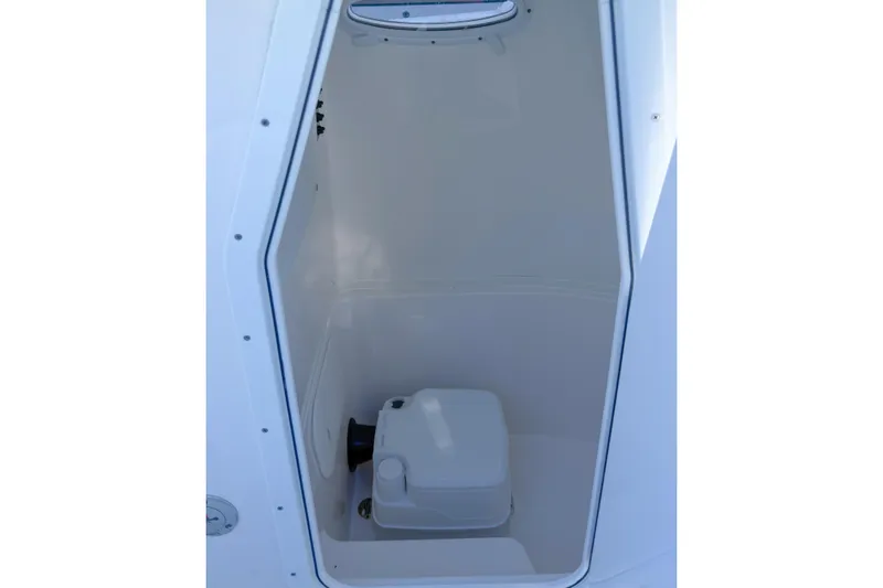 Slide: The Image of Manufacturer Provided Image: 2020 Cobia 220 Center Console boat cruising on clear turquoise water. - 7