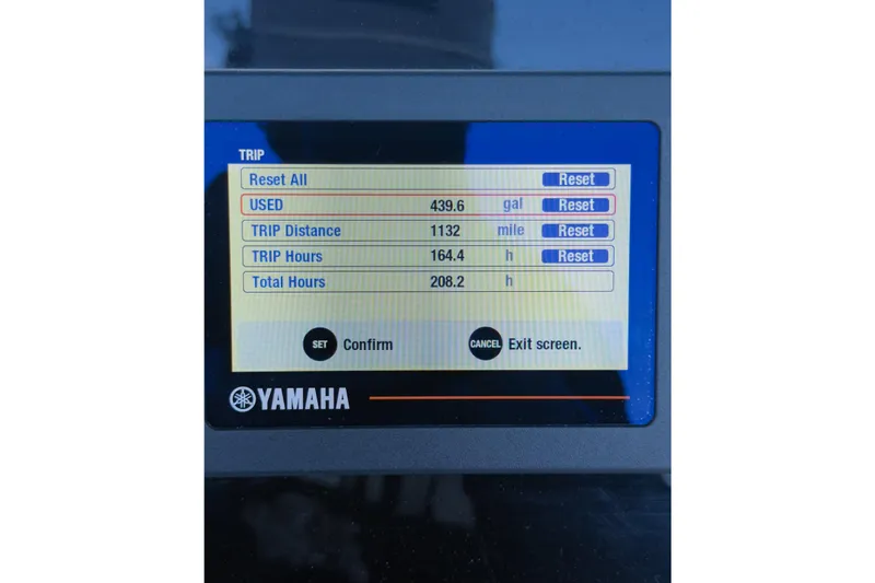 Slide: The Image of 2020 Cobia 220 Center Console boat on stands, clear sky background. - 8