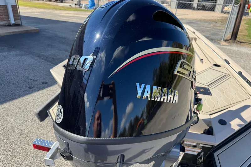 Slide: The Image of Yamaha 90 horsepower engine on 2026 Avid 18 Commander boat, outdoor setting. - 10