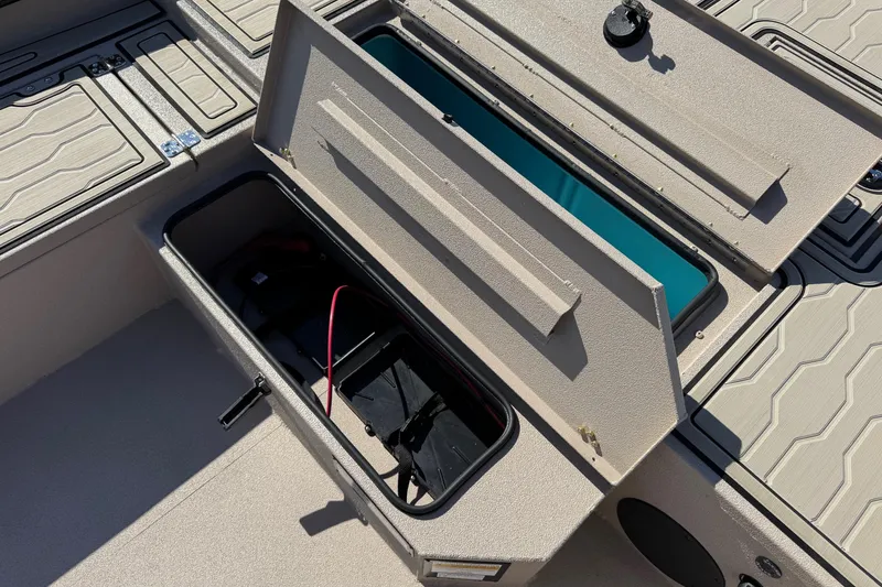 Slide: The Image of Open storage compartment on 2026 Avid 18 Commander boat, showcasing interior design and functionality. - 15