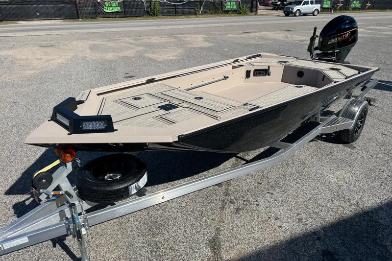 Slide: The Image of 2026 Avid 18 Commander boat on trailer, featuring sleek design and modern outboard motor. - 3