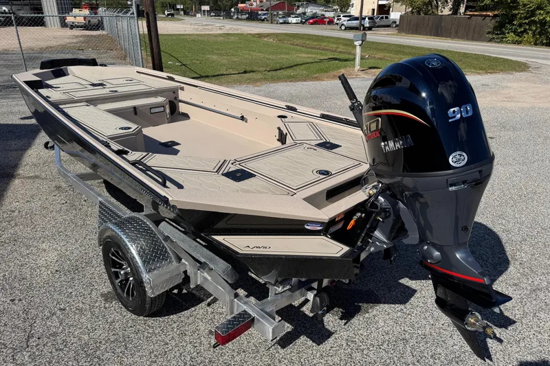 Slide: The Image of 2026 Avid 18 Commander boat with Yamaha 90 engine on a trailer. - 4