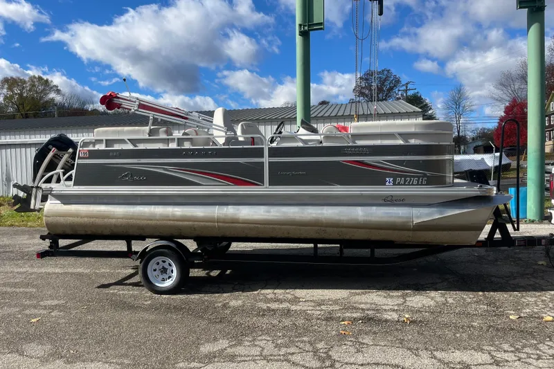 Slide: The Image of 2020 Apex Avanti 820 pontoon boat on trailer under blue sky. - 0