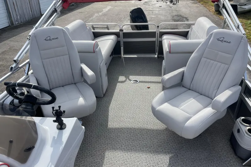 Slide: The Image of Interior of 2020 Apex Avanti 820 boat with plush seating and steering wheel. - 4
