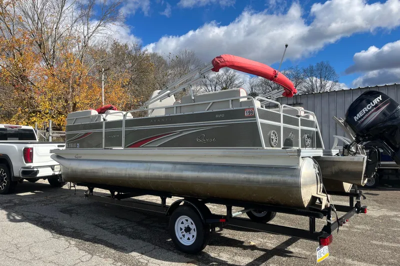 Slide: The Image of 2020 Apex Avanti 820 pontoon boat on trailer, parked beside a white truck. - 8