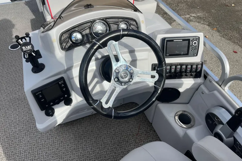 Slide: The Image of Steering console of 2020 Apex Avanti 820 boat with modern controls and navigation equipment. - 3