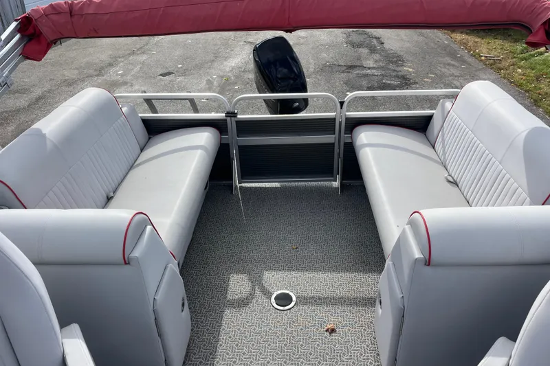 Slide: The Image of Interior of 2020 Apex Avanti 820 pontoon boat with gray seating and red accents. - 5