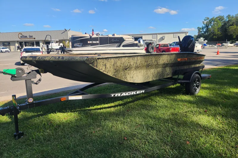 Slide: The Image of 2026 Tracker Grizzly 1756 T Marsh boat on trailer, parked on grass. - 6