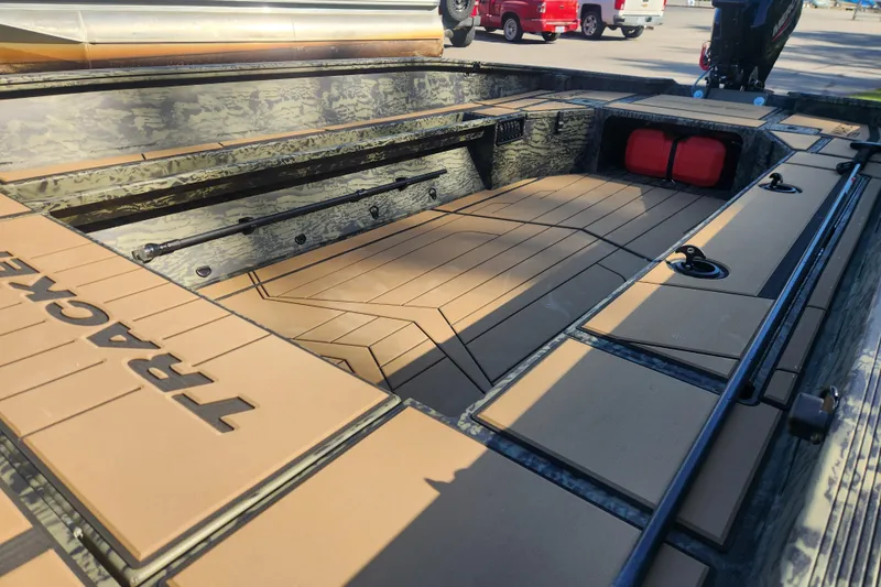 Slide: The Image of 2026 Tracker Grizzly 1756 T Marsh boat interior with camo design and spacious deck. - 7