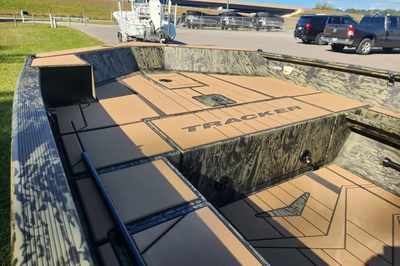 Slide: The Image of 2026 Tracker Grizzly 1756 T Marsh boat interior with camo design and spacious deck. - 9
