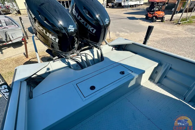 Slide: The Image of 2024 SeaArk 2672 Workhorse boat cabin with large windows and sturdy design. - 10