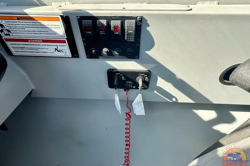 Slide: The Image of 2024 SeaArk 2672 Workhorse boat interior with steering wheel and controls. - 17