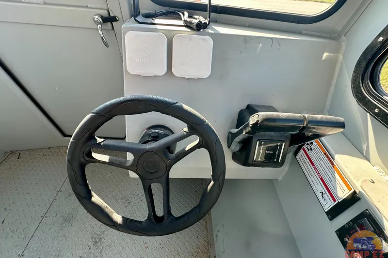 Slide: The Image of Interior of 2024 SeaArk 2672 Workhorse boat with two cushioned seats. - 18