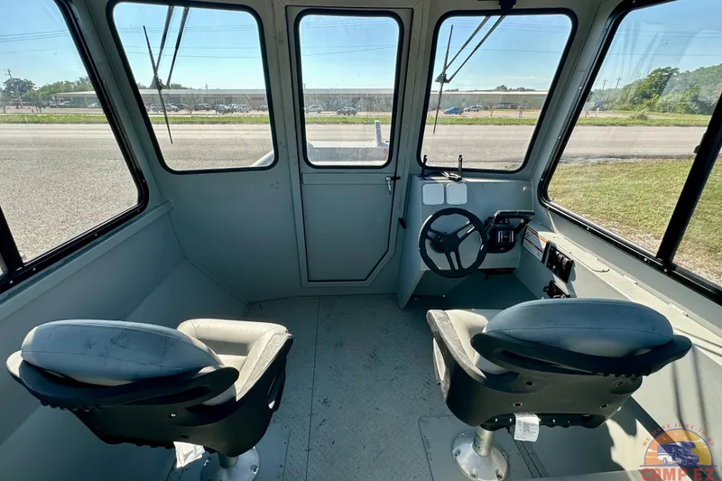 Slide: The Image of 2024 SeaArk 2672 Workhorse boat interior with diamond plate flooring and equipment. - 20