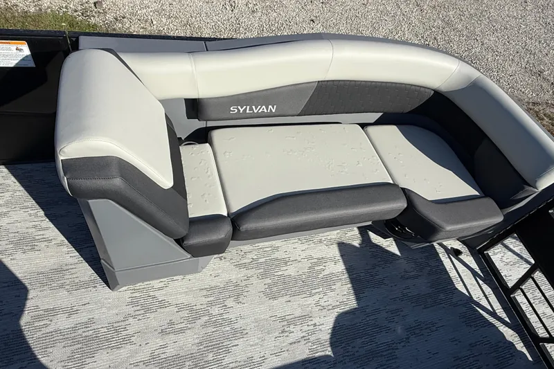 Slide: The Image of 2026 Sylvan R22 boat seating with gray and black upholstery on deck. - 11