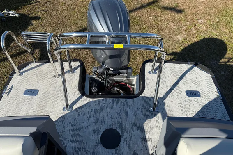 Slide: The Image of 2026 Sylvan R22 boat deck with motor and stainless steel railings. - 12