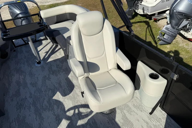 Slide: The Image of Luxurious seating on 2026 Sylvan R22 boat with modern design and cup holders. - 14