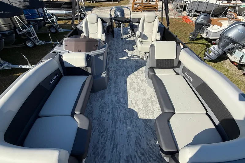 Slide: The Image of 2026 Sylvan R22 pontoon boat interior with spacious seating and modern design. - 4
