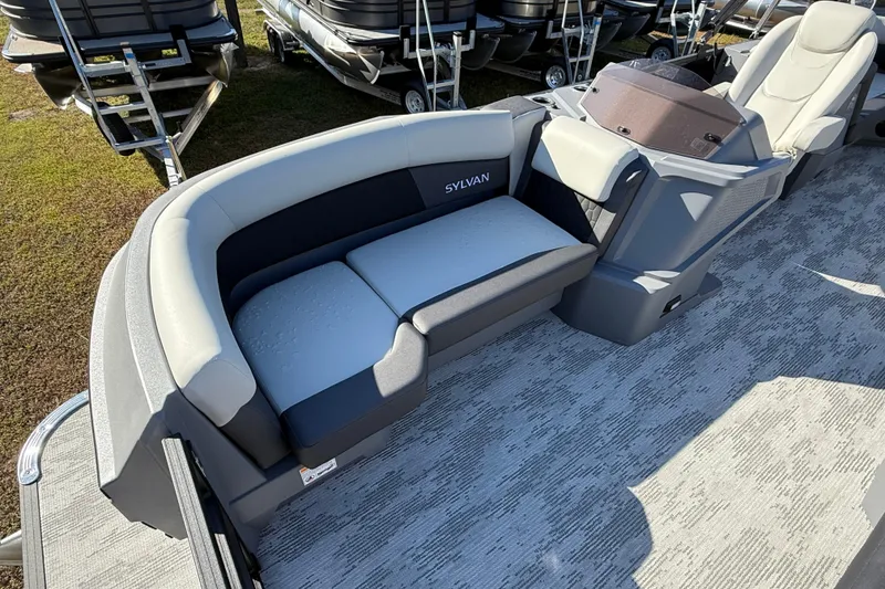 Slide: The Image of 2026 Sylvan R22 boat interior with gray seating and modern design. - 6