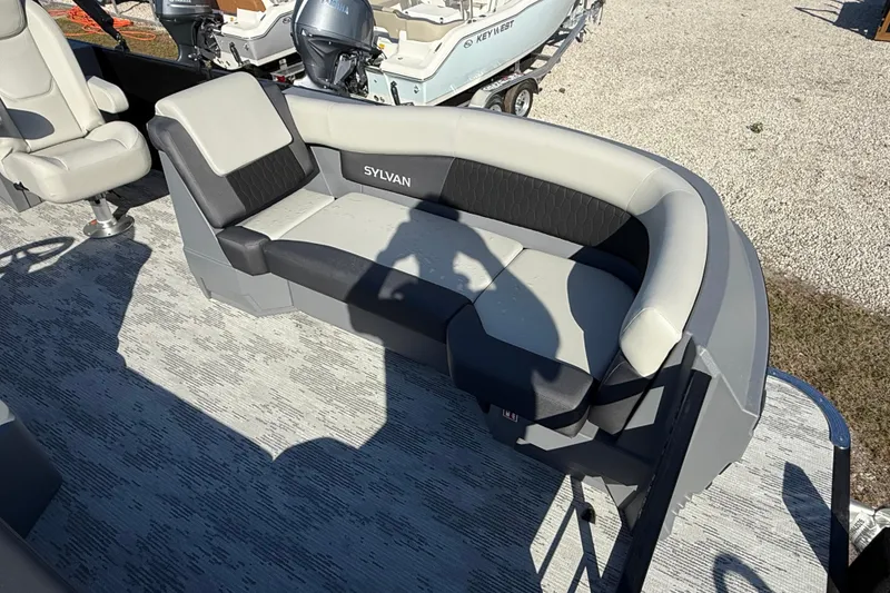Slide: The Image of 2026 Sylvan R22 boat interior with gray seating and modern design. - 7