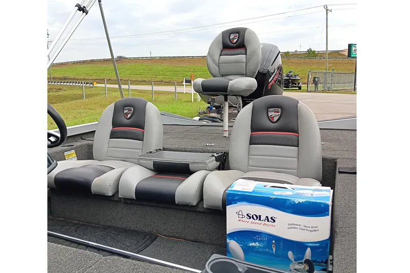 Slide: The Image of 2017 Triton 18 C TX boat interior with Solas propeller box on seat. - 11