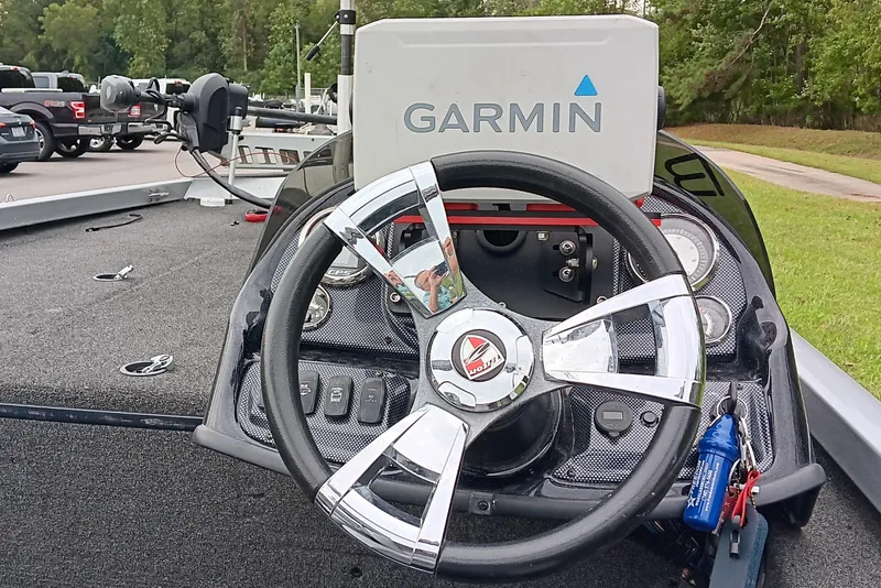 Slide: The Image of Steering wheel of 2017 Triton 18 C TX boat with Garmin GPS system. - 12