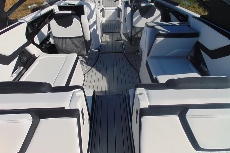 Slide: The Image of 2026 Yamaha Boats 252SD interior with sleek white and black seating design. - 10