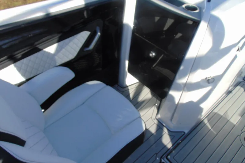 Slide: The Image of Interior of 2026 Yamaha Boats 252SD, featuring white seating and sleek design elements. - 17