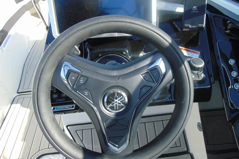 Slide: The Image of Steering wheel of 2026 Yamaha Boats 252SD, featuring modern controls and sleek design. - 20