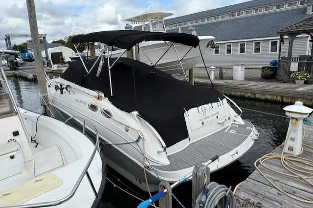 Slide: The Image of 2016 Glastron GS 289 boat docked with black cover and canopy. - 5