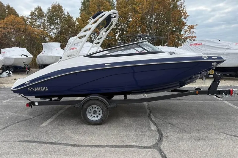 Slide: The Image of Steering wheel and dashboard of 2026 Yamaha Boats 195S, featuring modern controls and display. - 7