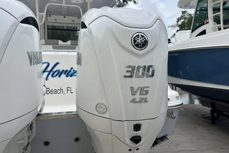 Slide: The Image of 2023 Robalo R302 Center Console with Yamaha 300 V6 outboard engines. - 14