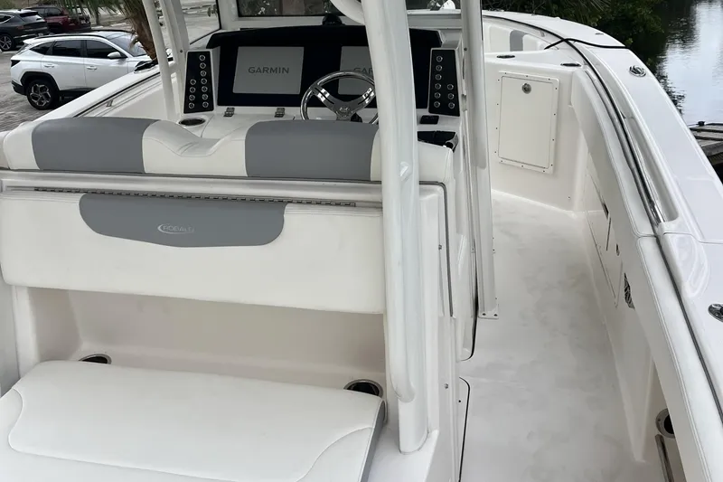 Slide: The Image of 2023 Robalo R302 Center Console boat interior with Garmin navigation system. - 19