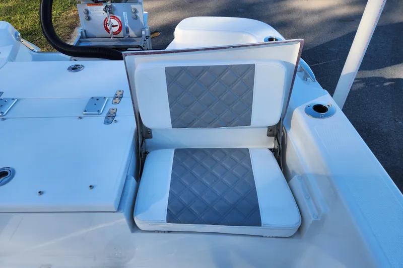 Slide: The Image of 2026 BlackJack 256 Bay boat seat with diamond-patterned upholstery. - 19