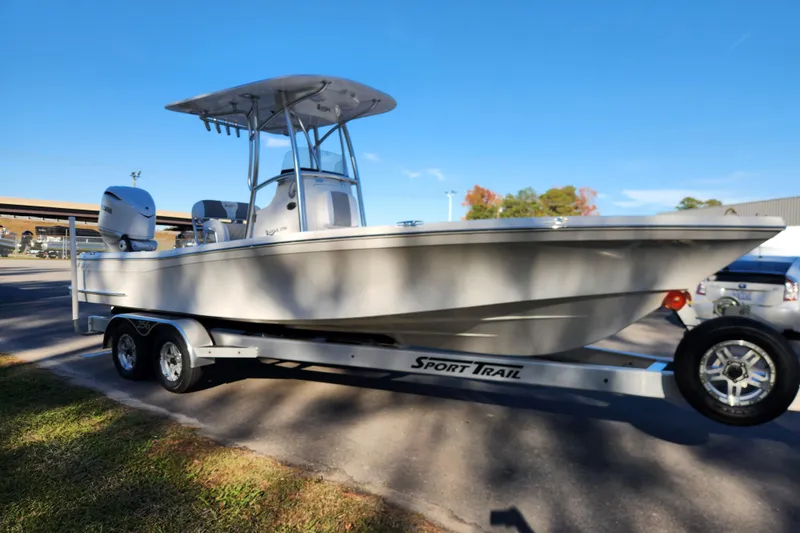 Slide: The Image of 2026 BlackJack 256 Bay boat on Sport Trail trailer, parked outdoors. - 6
